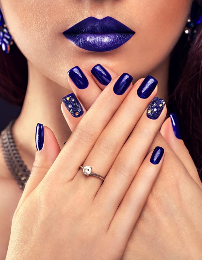 beautiful-woman-with-perfect-make-up-and-blue-manicure-wearing-jewellery